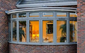 Grey aluminium flush sash bow windows