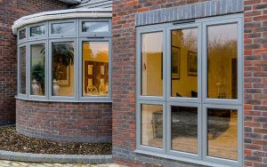 Grey aluminium flush sash and bow windows
