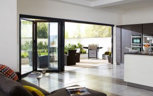 Black aluminium bifold door in a kitchen extension