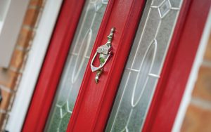 Close up of red composite entrance door