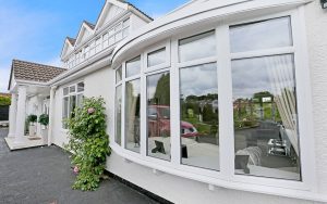 White uPVC bow window installation